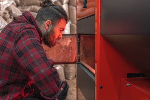 the-man-with-a-boiler-on-solid-fuel-open-door-boi-2021-10-13-17-51-04-utc